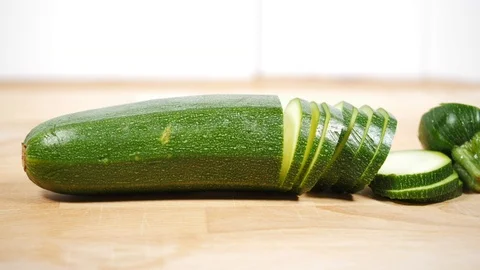 Raw vegetable. Isolated zucchini stop motion. slicing zucchini 動画素材 105228708