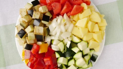Raw vegetables sliced on a plate. Stock Footage 245298182