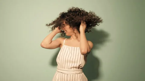 Raw video.Beautiful smiling model with afro curls hairstyle Stock Footage 142217127