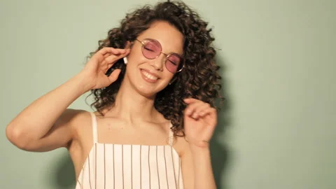 Raw video.Beautiful smiling model with afro curls hairstyle Stock Footage 142217240