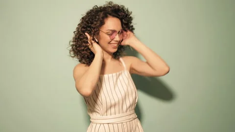 Raw video.Beautiful smiling model with afro curls hairstyle Stock Footage 142217390