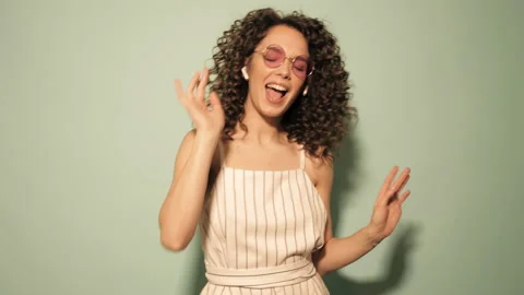 Raw video.Beautiful smiling model with afro curls hairstyle Stock Footage 142218426