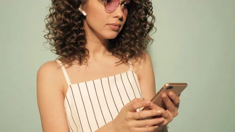 Raw video.Beautiful smiling model with afro curls hairstyle Stock Footage 142218927