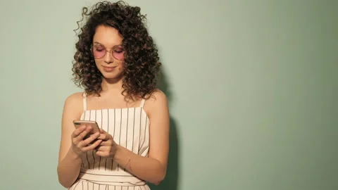 Raw video.Beautiful smiling model with afro curls hairstyle Stock Footage 142221805