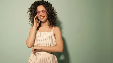 Raw video.Beautiful smiling model with afro curls hairstyle Stock Footage 142222126