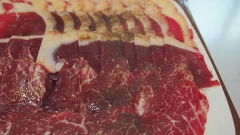 Raw Wagyu A5 beef sliced with marbled texture served for Sukiyaki and Shabu Stock Footage 146391660