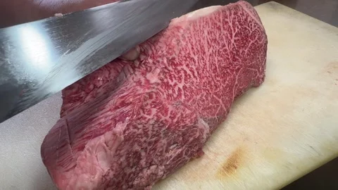 Raw Wagyu Beef Block Cut into Thick Red Steaks with a Knife, Japanese Food Stock Footage 343010605