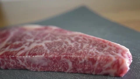 Raw Wagyu Beef Steak with High Marbling on Cutting Board Stock Footage 336183346