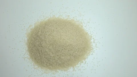 The raw white basmati rice grains on the white table. Close up, detail, POV. Stock Footage 128844882