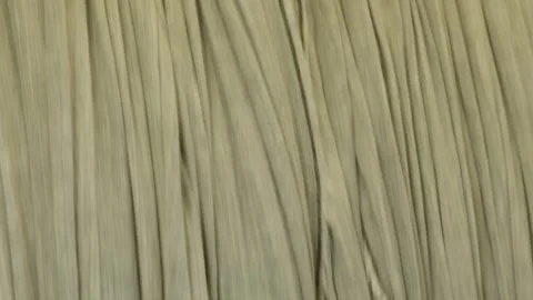 Raw white fabric that passes through a washing machine in a textile mill Stock Footage 291871033