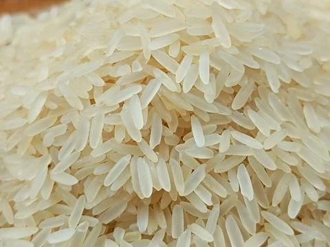 Raw white rice background, close-up Stock Photos