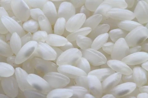 Raw white rice background macro Stock Photos