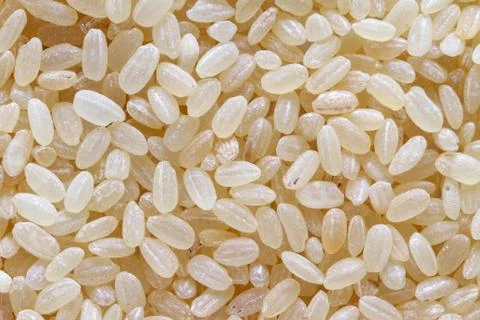 Raw white rice background macro Stock Photos