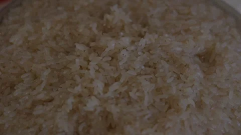 Raw white rice soaking in water inside a glass bowl. Stock Footage 343891862
