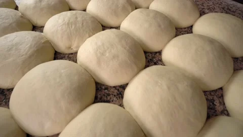 Raw yeast balls for background dough in frying pan before baking. Stock Footage 191562799