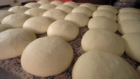 Raw yeast balls for background dough in frying pan before baking. Stock Footage 191563276