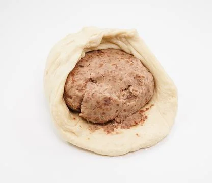Raw Yeast Dough with Bean Paste Filling on a White Background 写真素材