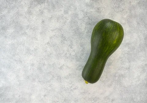 Raw zucchini on a light gray table. Top view, copy space Stock Photos