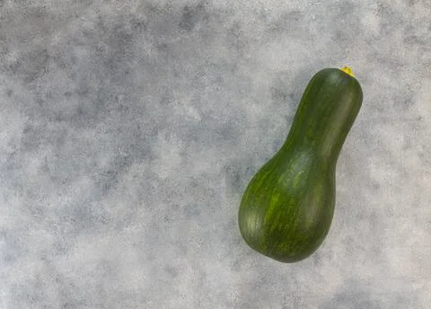 Raw zucchini on a light gray table. Top view, copy space Stock Photos
