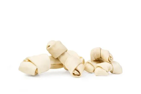 Rawhide bones on a white background with copy space Stock Photos