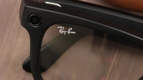 Ray Ban Meta smart glasses, isolated on a wooden background Stock Footage 297481795