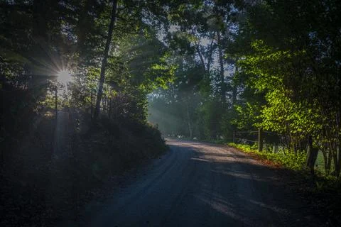 Ray of light and shadow over road from Czech to Austria near border Stock Photos