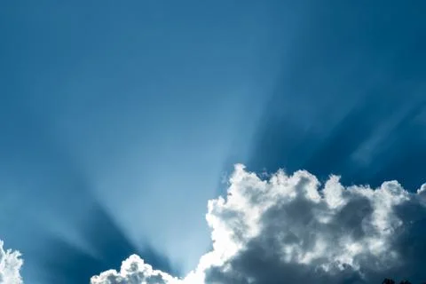Ray light back white cloud in blue sky Stock Photos