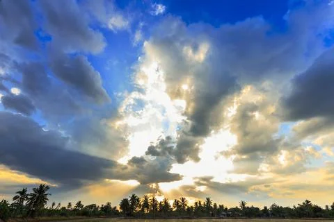 Ray of light breaks through the dramatic sky at sunset Foto stock