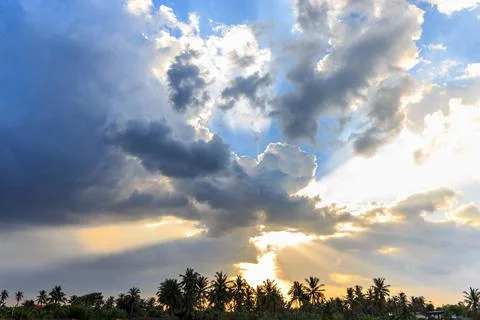 Ray of light breaks through the dramatic sky at sunset Foto stock