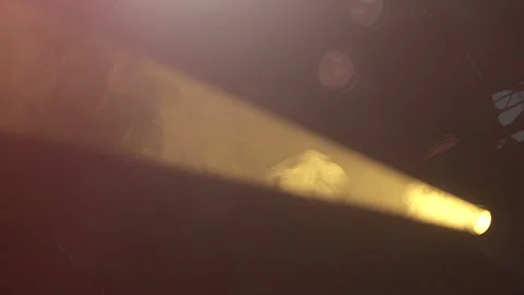 A ray of light on a dark background of concert smoke on a theater stage Stock Footage 252749755