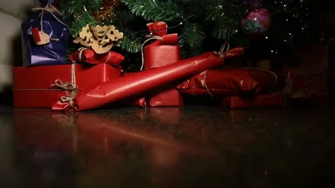 A ray of light from the darkness shows Christmas gifts Stock Footage 139923399