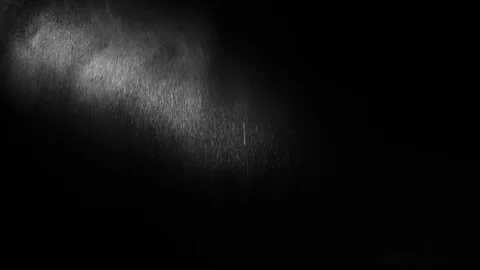 A ray of light illuminating a spray of water Stock Footage 100463830