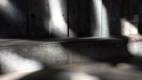 Ray of light moving along a stone wall. Time lapse Stock Footage 113056845