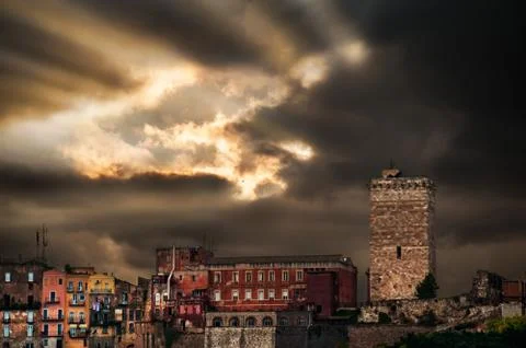 Ray of light that pierces the clouds above the city Stock Photos