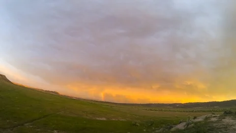 Ray of light sunset, rainbow, clouds moving, green grass timelapse Stock Footage 108289725