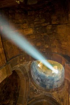 A ray of light in the temple passes through a window in the dome Stock Photos