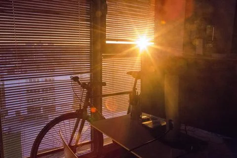 Ray of light through the bedroom blinds Stock Photos