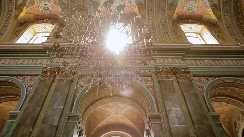 A ray of light through the chandelier in the cathedral Stock Footage 76047108