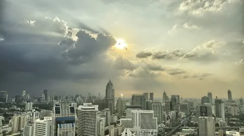 Ray of Lights through clouds over Bangkok CIty SKyline in HDR Stock Footage 12531110