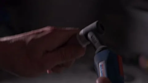 The ray of small lights coming out from the tip of the welding machine Stock Footage 152415487