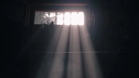 A ray of sun breaks into the room through the window. beautiful haze of sun dust Stock Footage 133078283