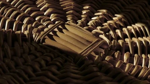 A ray of the sun moves over a wicker basket fragment. Stock Footage 164966446