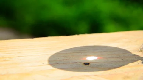 A ray of sun passing through a magnifying glass. Stock Footage 128933616