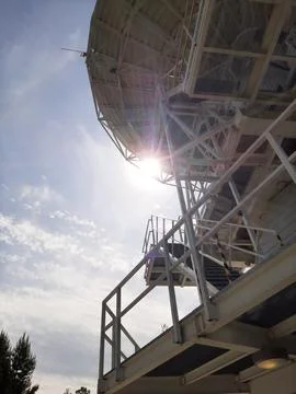 A ray of the sun shines through the disk of the telescope Stock Photos