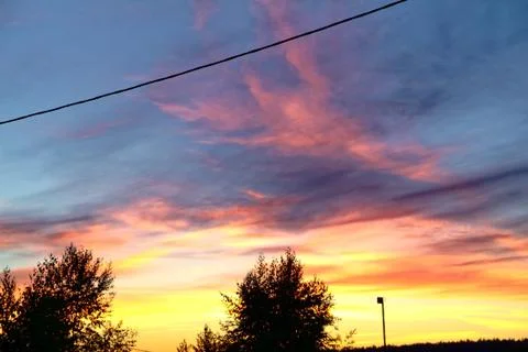 A ray of sun at sunset through clouds Stock Photos