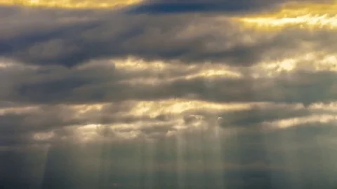 A ray of sunlight breaking through dark clouds Stock Footage 69122505
