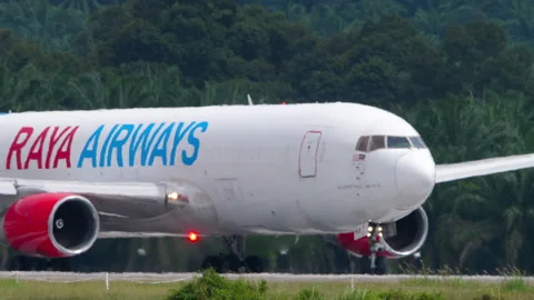 Raya Airways Boeing 767-200 freighter 9M-RXB lining up on runway Stock Footage 346850785