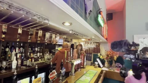 Rayner and Reeves pull pints in the West Midlands Stock Footage 277647849