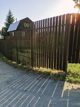 Rays breaking through the brown fence Stock Photos