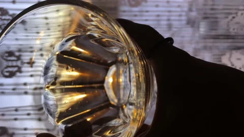The rays of the early sun shimmer in a glass of water Stock Footage 238551902